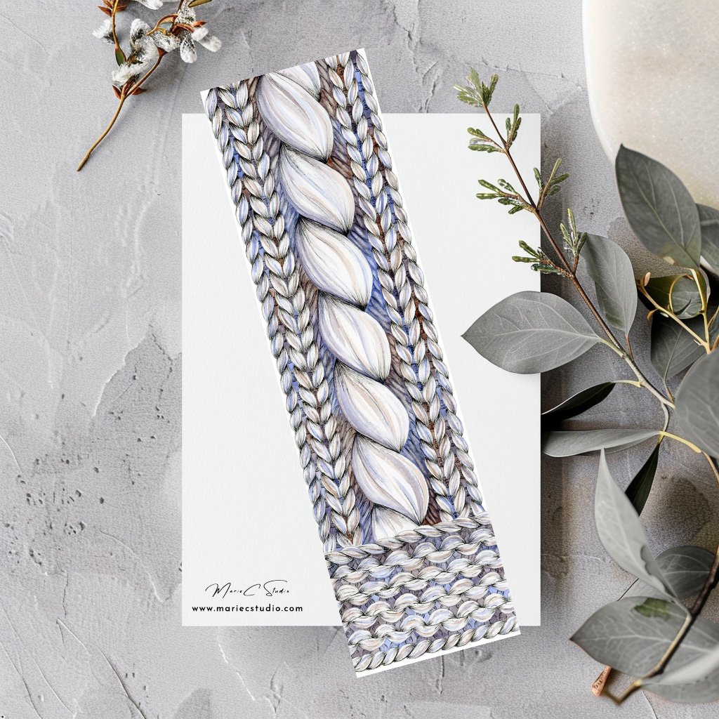 Marque-page Tricot 2 Marque-page décoré de points de tricot dessinés à l'aquarelle et à l'encre et posé sur un plan de travail effet pierre